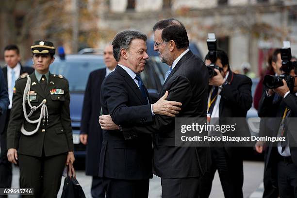 President of Colombia Juan Manuel Santos and Spanish Prime Minister Mariano Rajoy congratulate each other as they arrive at the Premio Nueva Economia...