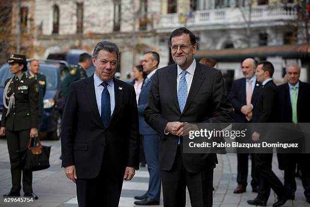 President of Colombia Juan Manuel Santos and Spanish Prime Minister Mariano Rajoy pose for photographers as they arrive at the Premio Nueva Economia...