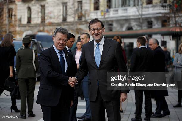 President of Colombia Juan Manuel Santos and Spanish Prime Minister Mariano Rajoy pose for photographers as they arrive at the Premio Nueva Economia...