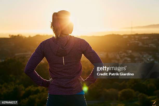 female runner - woman standing exercise stock-fotos und bilder