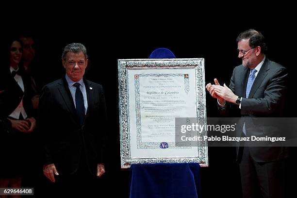 Spanish Prime Minister Mariano Rajoy congratulates to President of Colombia Juan Manuel Santos as he gives him the Premio Nueva Economia Forum 2016...