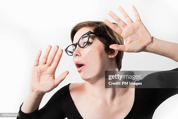 woman hitting glass wall - transparent blouse stock pictures, royalty-free photos & images