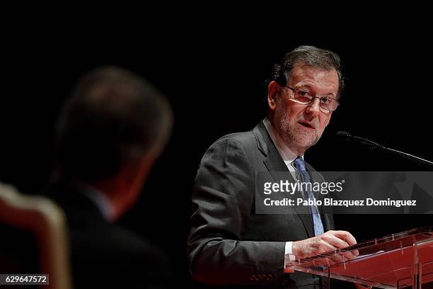 Spanish Prime Minister Mariano Rajoy looks at President of Colombia Juan Manuel Santos during his speech at the Premio Nueva Economia Forum 2016...