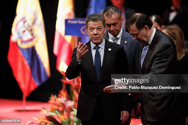 President of Colombia Juan Manuel Santos and Spanish Prime Minister Mariano Rajoy gesture as they leave the Premio Nueva Economia Forum 2016 ceremony...