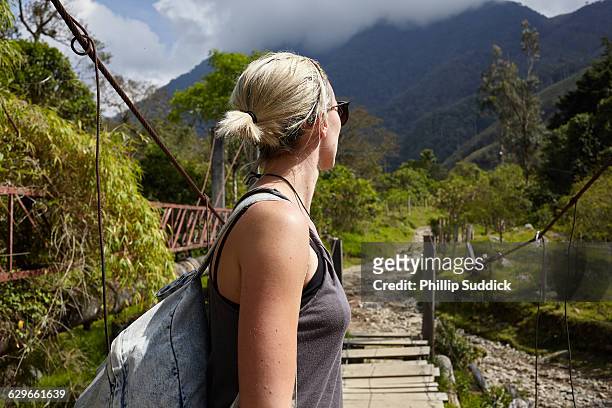 loan female traveller walking exploring nature - nosara costa rica stock pictures, royalty-free photos & images