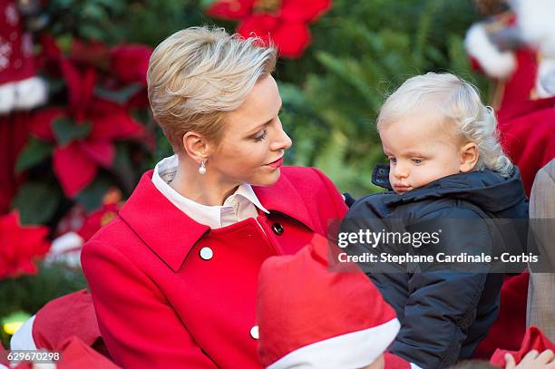 Princess Charlene of Monaco and Prince Jacques of Monaco attend the Christmas gifts distribution at Monaco Palace on December 14, 2016 in Monaco,...