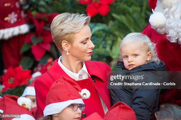 Princess Charlene of Monaco and Prince Jacques of Monaco attend the Christmas gifts distribution at Monaco Palace on December 14, 2016 in Monaco,...