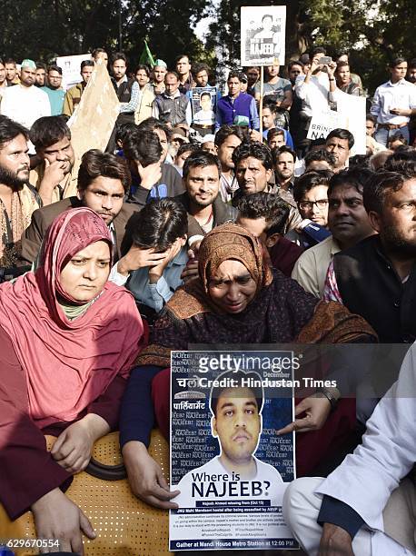 Students with Fatima Nafees, mother of missing JNU student Najeeb Ahmed, during a protest march and dharna against Delhi Police at Jantar Mantar, on...