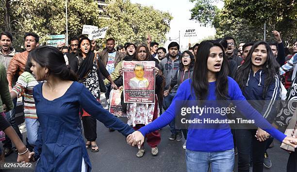 Students with Fatima Nafees, mother of missing JNU student Najeeb Ahmed, during a protest march and dharna against Delhi Police at Jantar Mantar, on...