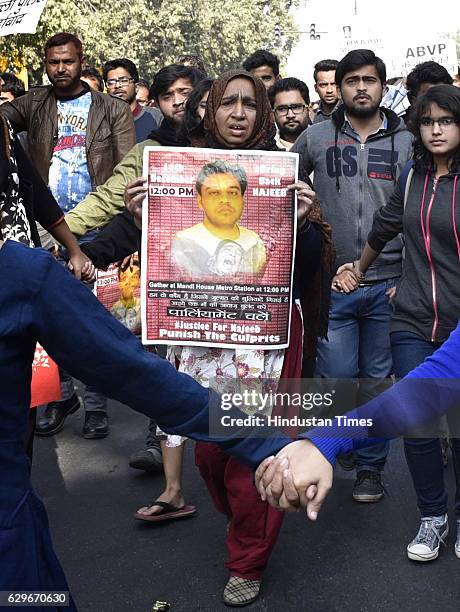 Students with Fatima Nafees, mother of missing JNU student Najeeb Ahmed, during a protest march and dharna against Delhi Police at Jantar Mantar, on...