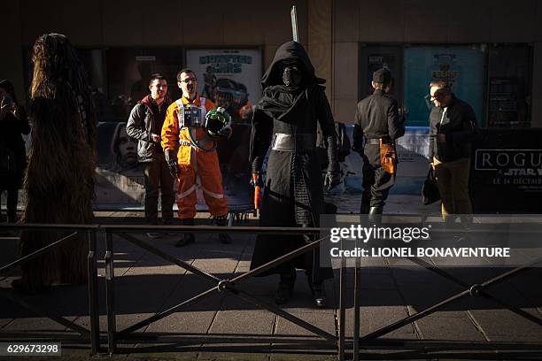 Person dressed as Kylo Ren of Star Wars poses on December 14, 2016 at the Grand Rex cinema in Paris on the first day of the European release of Star...