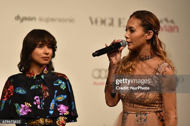 Japanese American singer Anna Tsuchiya and Japanese fashion model Loveli attend the opening ceremony of Vogue Fashion's Night Out 2016 at Omotesando...
