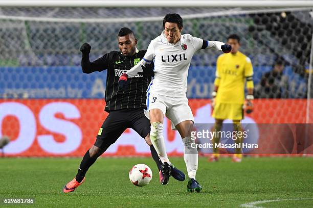 Gen Shoji of Kashima and Miguel Borja of Atletico Nacional compete for the ball during the FIFA Club World Cup Semi Final between Atletico Nacional...
