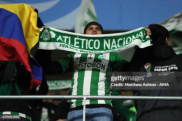 An Atletico Nacional fan shows his support during the FIFA Club World Cup Semi Final match between Atletico Nacional and Kashima Antlers at Suita...