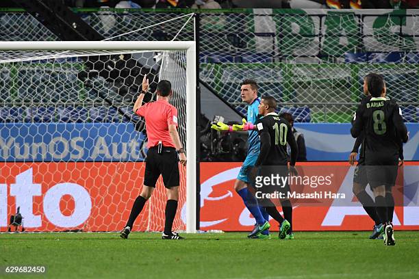 Match Referee, Viktor Kassai, awards a penalty to Kashima Antlets during the FIFA Club World Cup Semi Final between Atletico Nacional and Kashima...