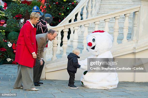 Princess Charlene of Monaco, Prince Albert II of Monaco and Prince Jacques of Monaco attend the Christmas Gifts Distribution At Monaco Palace on...