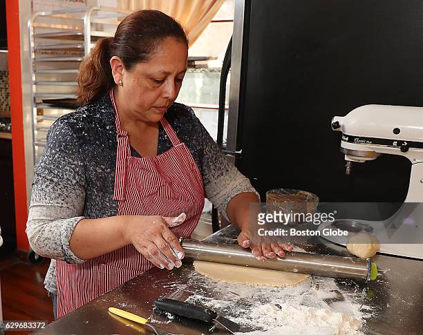 Doris Montoya rolls out the dough for the alfajores, a Peruvian cookies in her home bakery called Doris Peruvian Pastries in Marlborough, Mass., on...