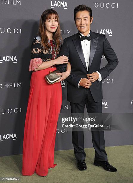 Actors Lee Min-jung and Lee Byung-hun, wearing Gucci, arrive at the 2016 LACMA Art + Film Gala Honoring Robert Irwin And Kathryn Bigelow Presented By...