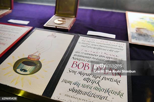 Medal and certificate of the Nobel Prize in Literature Bob Dylan are displayed at the Nobel Prize Banquet at City Hall on December 10, 2016 in...