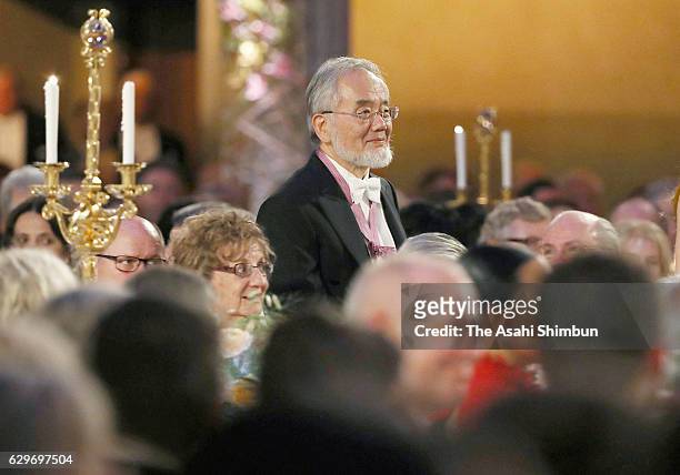 Nobel Prize in Physiology or Medicine laureate Yoshinori Ohsumi walks to address during the Nobel Prize Banquet at City Hall on December 10, 2016 in...