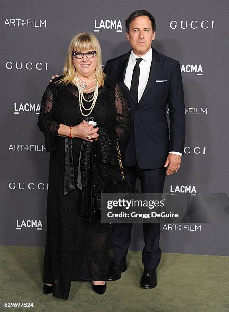 Writer/director David O. Russell and guest arrive at the 2016 LACMA Art + Film Gala Honoring Robert Irwin And Kathryn Bigelow Presented By Gucci at...