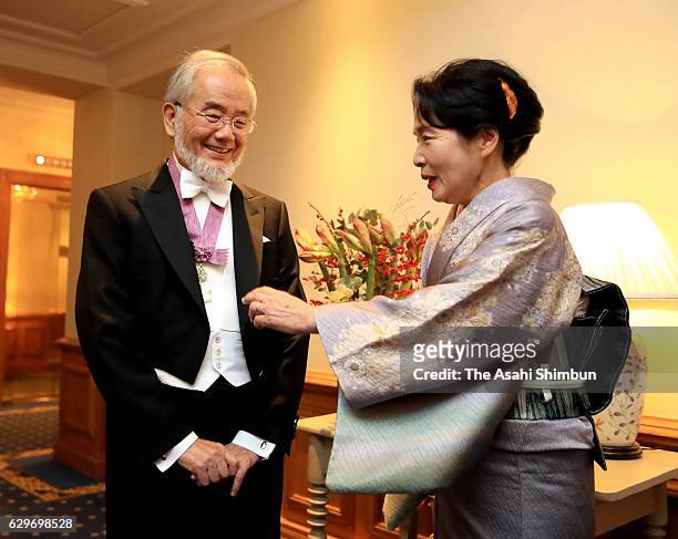 Nobel Prize in Physiology or Medicine laureate Yoshinori Ohsumi and his wife Mariko prepare to attend the Nobel Prize Awards Ceremony at their hotel...