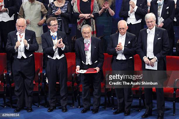 Nobel Prize in Physiology or Medicine laureate Yoshinori Ohsumi acknowledges after receiving his Nobel Prize from King Carl XVI Gustaf of Sweden...