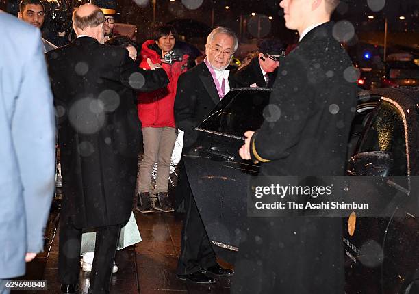 Nobel Prize in Physiology or Medicine laureate Yoshinori Ohsumi leaves his hotel to attend the Nobel Prize Awards Ceremony on December 10, 2016 in...