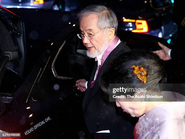 Nobel Prize in Physiology or Medicine laureate Yoshinori Ohsumi and his wife Mariko leave their hotel to attend the Nobel Prize Awards Ceremony on...