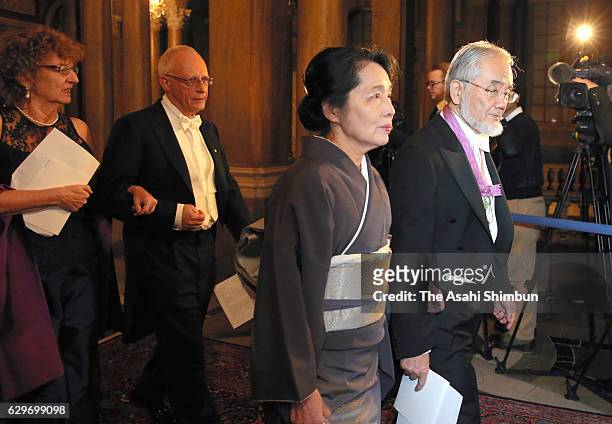 Nobel Prize in Physiology or Medicine Yoshinori Ohsumi and his wife Mariko are seen on arrival to attend the Nobel Prize Banquet at City Hall on...
