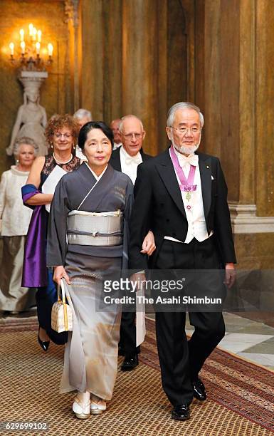 Nobel Prize in Physiology or Medicine Yoshinori Ohsumi and his wife Mariko are seen on arrival to attend the Nobel Prize Banquet at City Hall on...