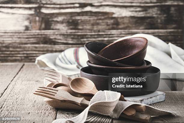 simple crockery and wooden cooking utensils set on rustic table - loja de utensílios de cozinha imagens e fotografias de stock