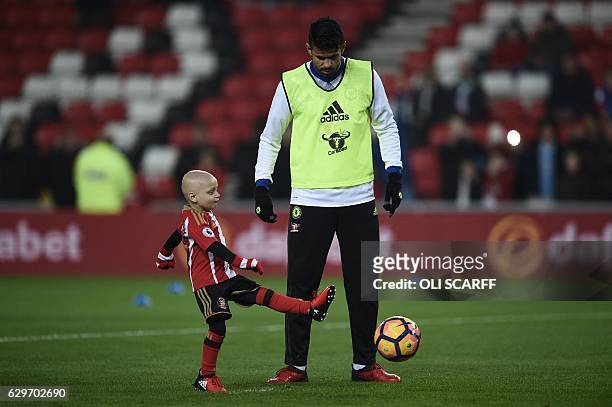 Five year old Sunderland fan and cancer patient Bradley Lowery warms up with Chelsea's Brazilian-born Spanish striker Diego Costa ahead of the...