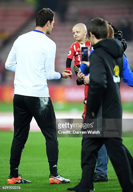 Asmir Begovic of Chelsea speaks to Bradley Lowrey during the warm up during the Premier League match between Sunderland and Chelsea at Stadium of...