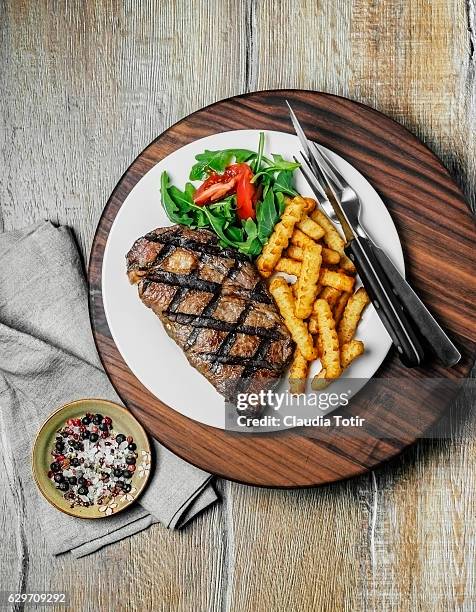 steak with french fries - steakhouse stock pictures, royalty-free photos & images