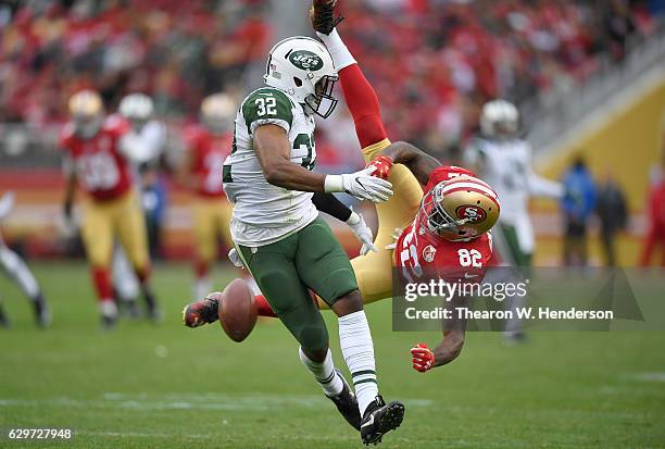 Juston Burris of the New York Jets breaks up the pass intended for Torrey Smith of the San Francisco 49ers during the third quarter of their NFL...