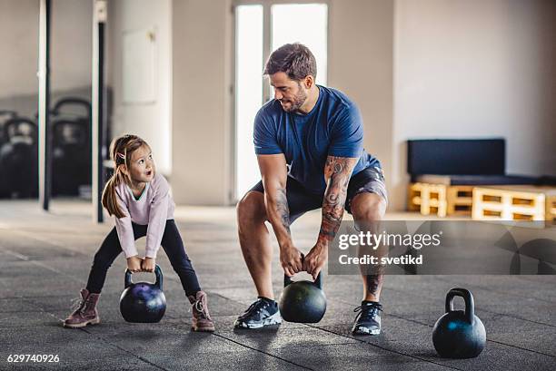 she's gonna be strong like daddy - active child bildbanksfoton och bilder