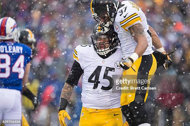 Jordan Dangerfield congratulates Roosevelt Nix-Jones of the Pittsburgh Steelers on a defensive stop during the first half against the Buffalo Bills...
