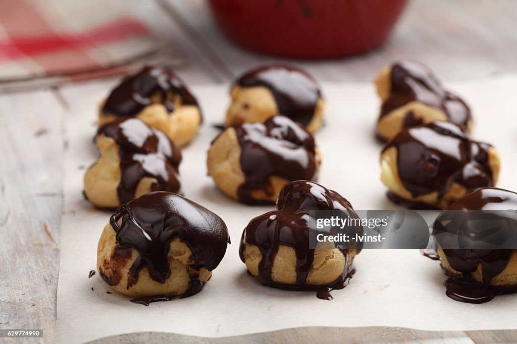 Profiteroles glazed with chocolate