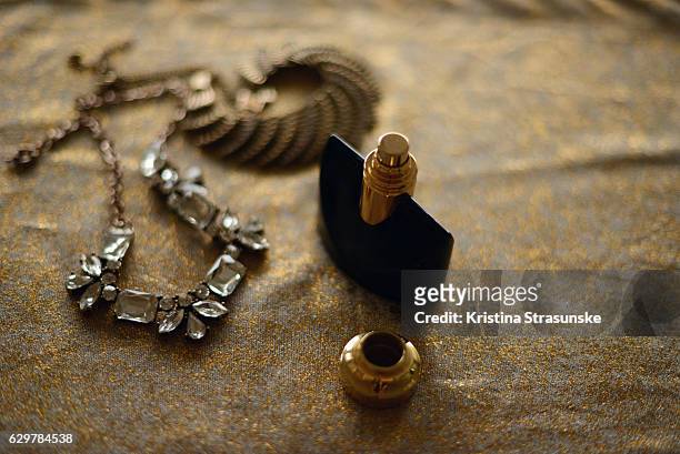 perfume bottle and two necklaces - black gemstone stock pictures, royalty-free photos & images