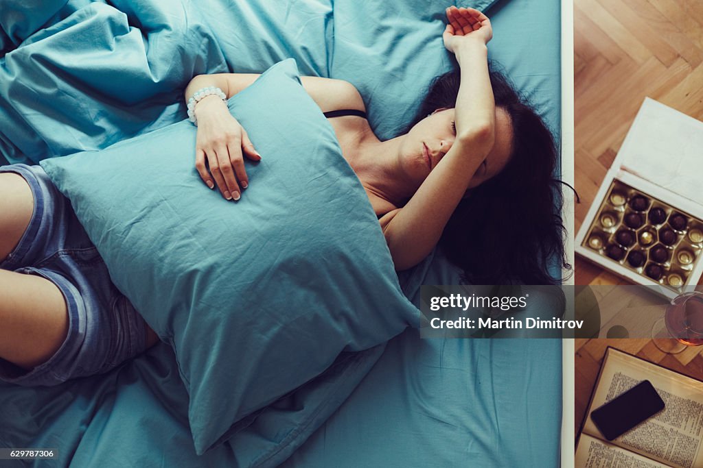 Sick woman sleeping at home