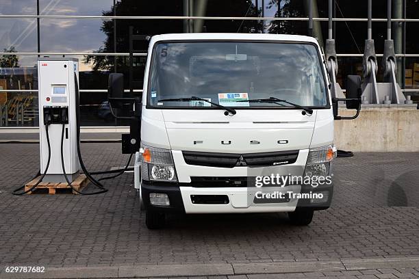 fuso canter e-cell on the charging station - mitsubishi fuso truck stock pictures, royalty-free photos & images