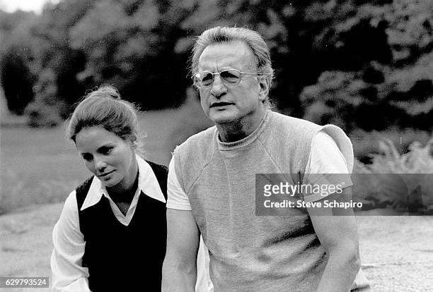 Married American actors Trish Van Devere and George C Scott sit outdoors at their home, New York, 1976.