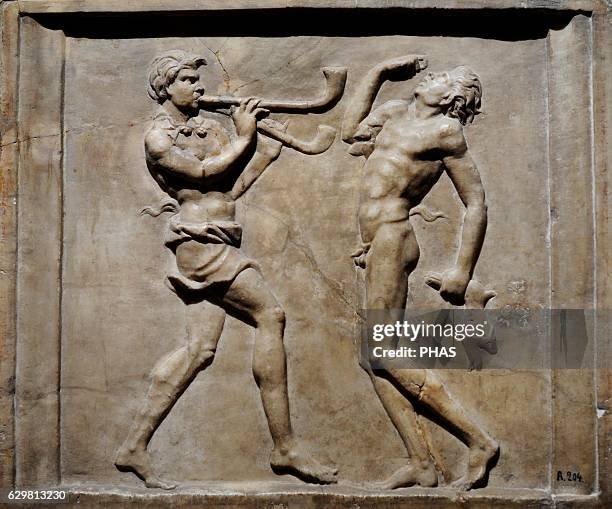 Roman relief depicting dancing Satyrs. Marble. 1st century AD. Part of a decorative cycle depicting Dionysus and Ariadne. The State Hermitage Museum....