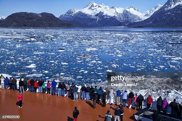 lots of people watching glacier on a cruise ship, alaska - alaska cruise stock pictures, royalty-free photos & images