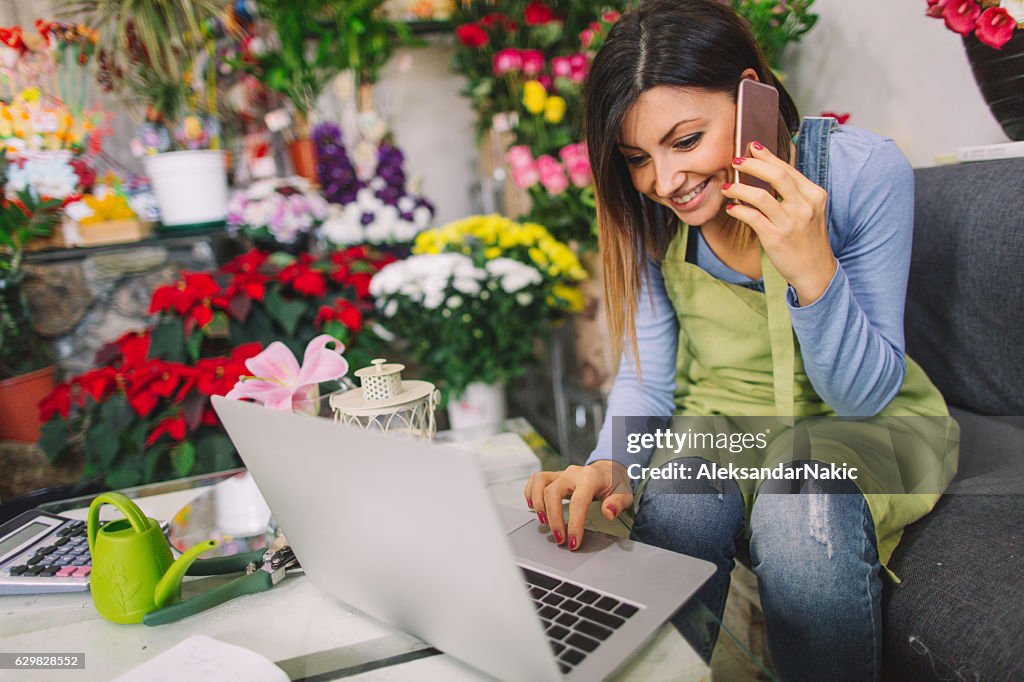 Florist taking orders on the phone