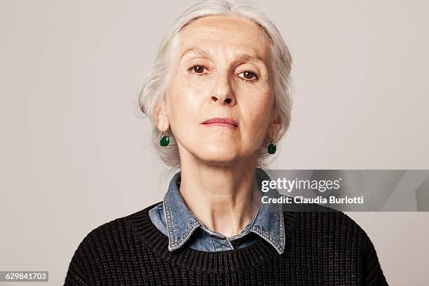 lady looking young - serieus stock pictures, royalty-free photos & images