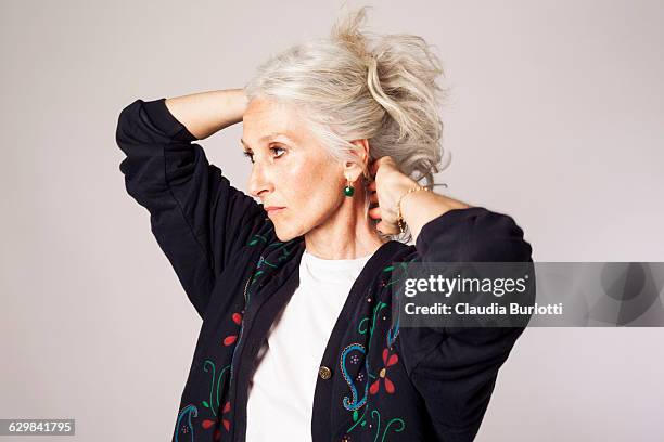 lady looking young - woman with hand in hair stock pictures, royalty-free photos & images