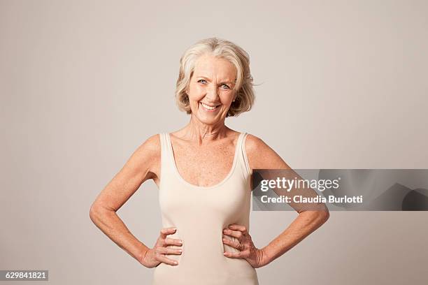 lady looking young - camiseta de tirantes fotografías e imágenes de stock