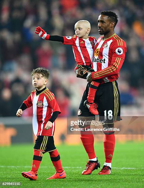 Bradley Lowrey and Jermain Defoe of Sunderland walk into the pitch prior to the Premier League match between Sunderland and Chelsea at Stadium of...